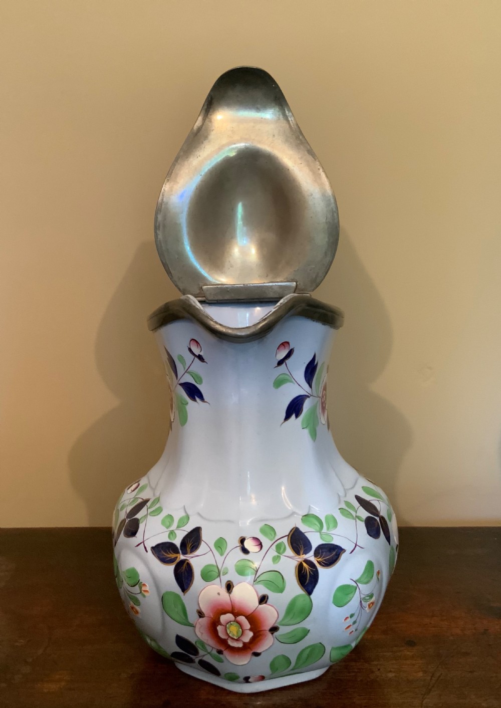 A trio of Pompeii design pottery jugs View V