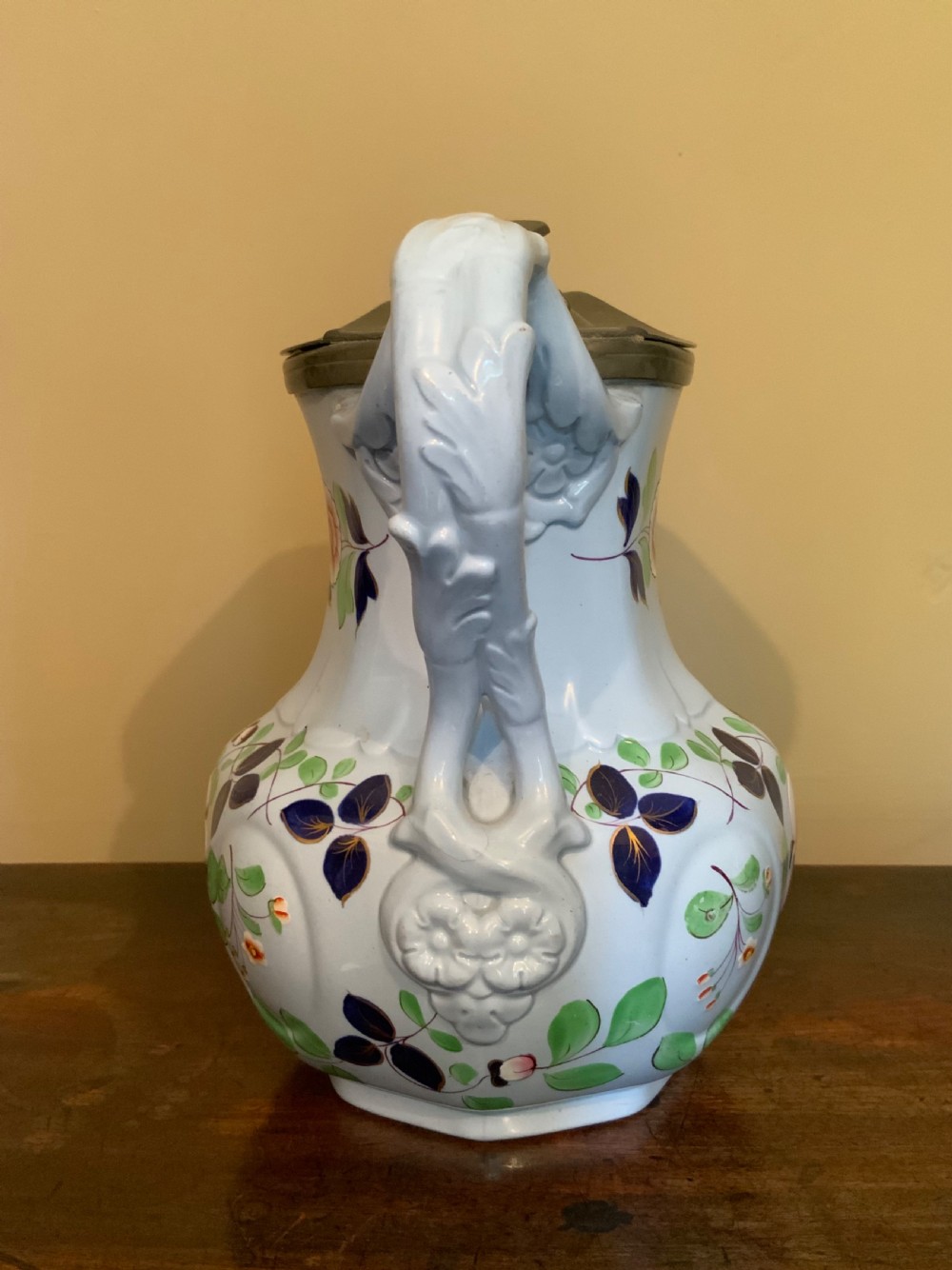 A trio of Pompeii design pottery jugs View VI