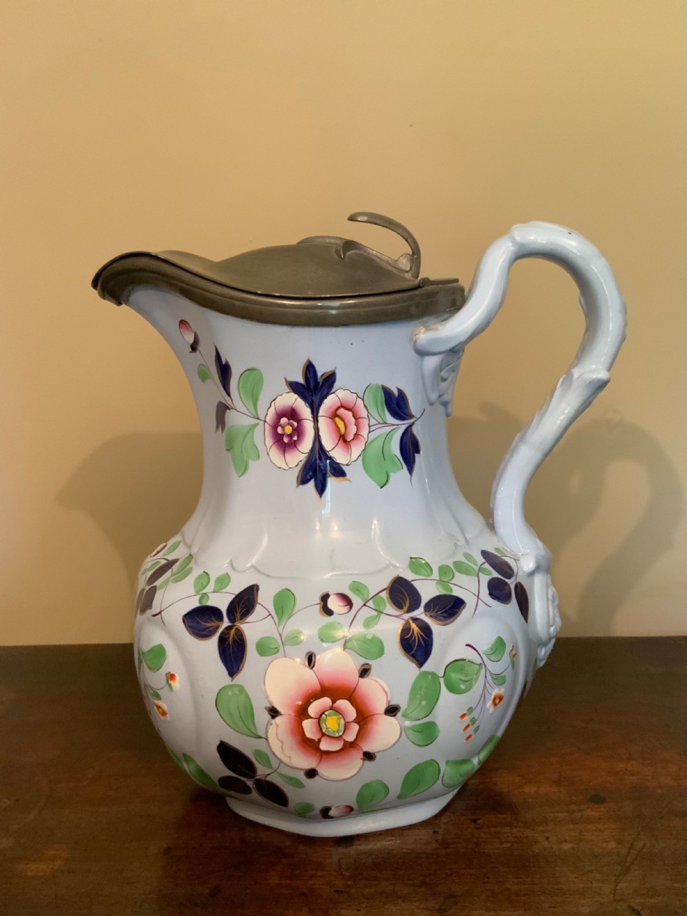 A trio of Pompeii design pottery jugs View IX