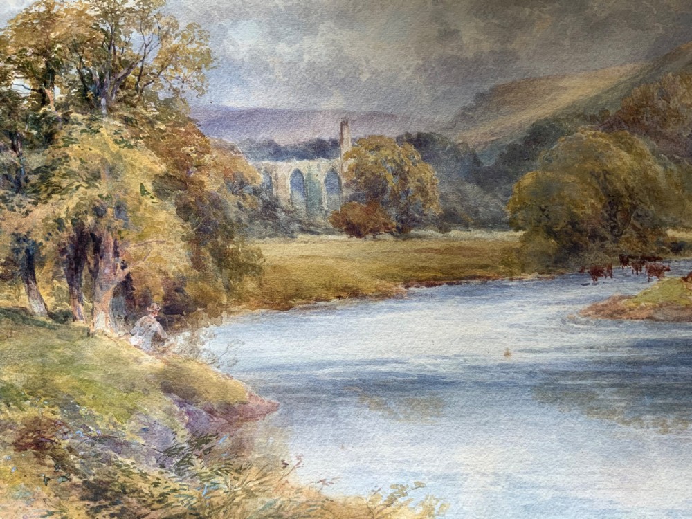 A framed 19th-century watercolour painting depicting a river running through a green landscape with trees and distant hills, set within an ornate gold gilt frame. View V