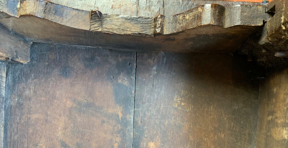 A 17th-century dark oak side table featuring turned legs, carved scroll spandrels, and lower stretcher rails. View VIII