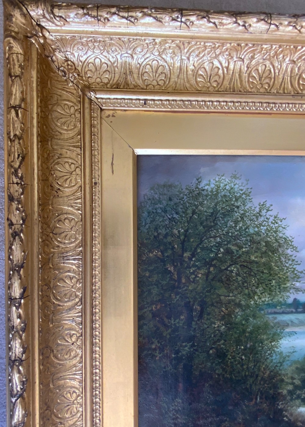 An antique 19th-century pastoral oil painting on canvas showing a shepherd driving sheep along a riverbank, set within an ornate gilded frame. View III