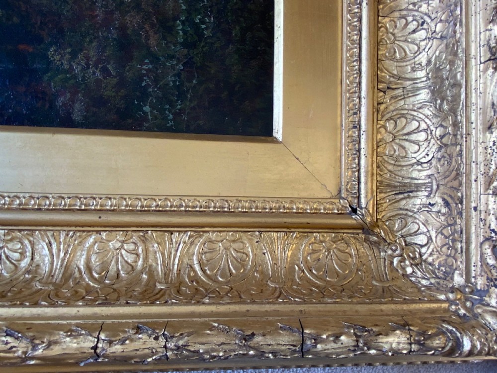 An antique 19th-century pastoral oil painting on canvas showing a shepherd driving sheep along a riverbank, set within an ornate gilded frame. View IV