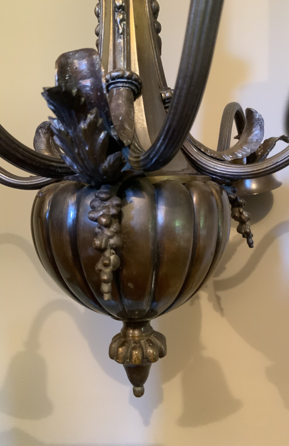 A dark patinated bronze five-arm chandelier featuring downward-facing bell shades, reeded scroll arms, and an ornate central stem. View III