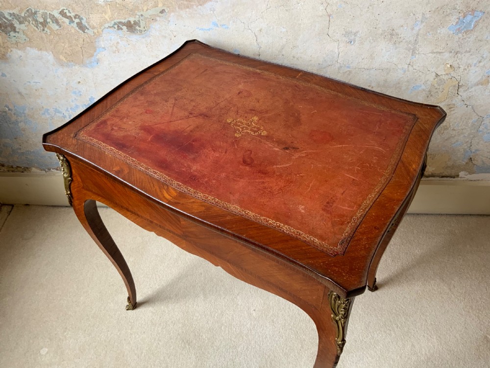 A 19th century leather topped writing table View II