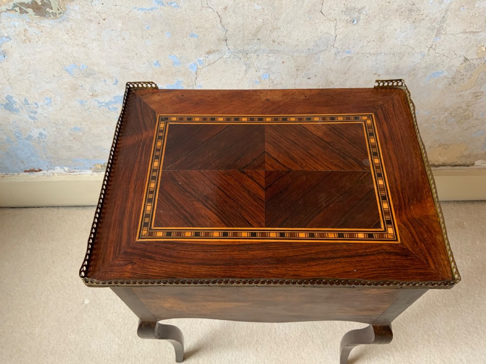 A rosewood side table View IV