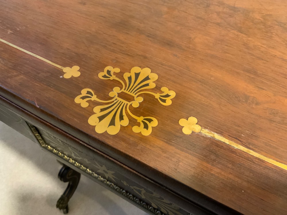 A Regency period brass inlaid games table
 View VI