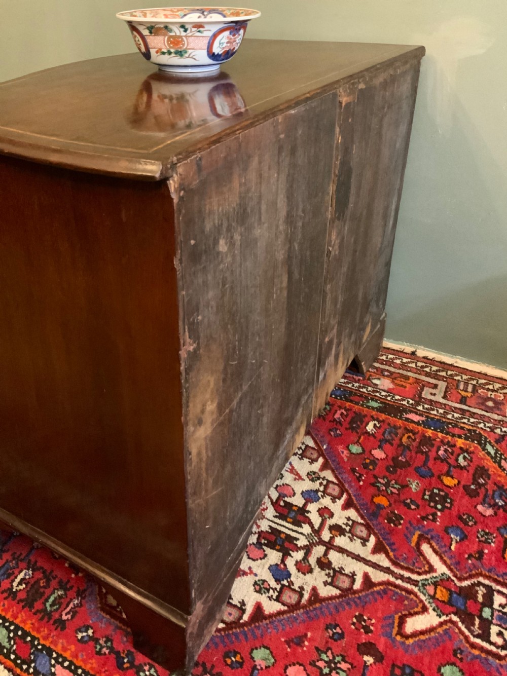 A George III serpentine chest of drawers View IV