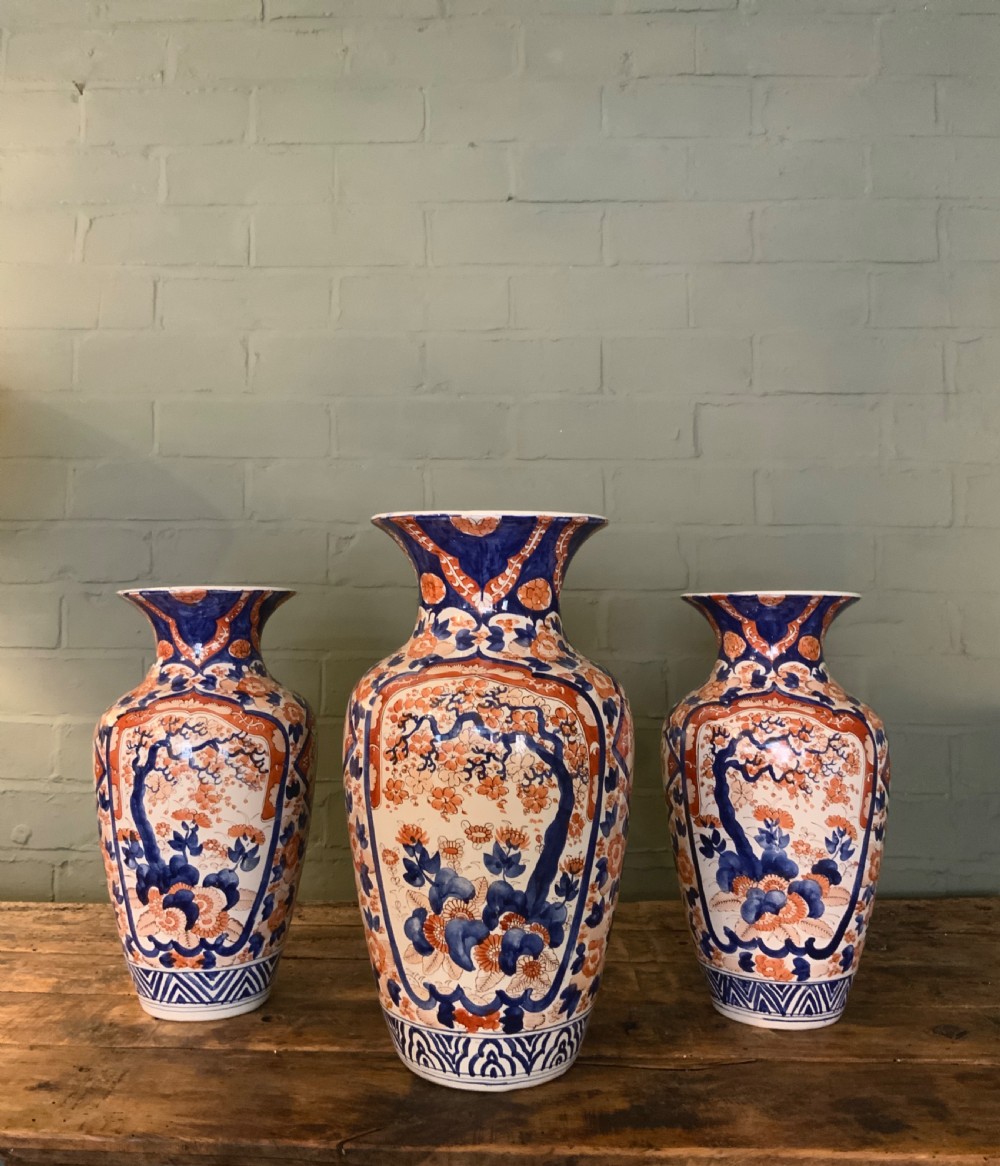 A garniture of 3 large Japanese Imari vases