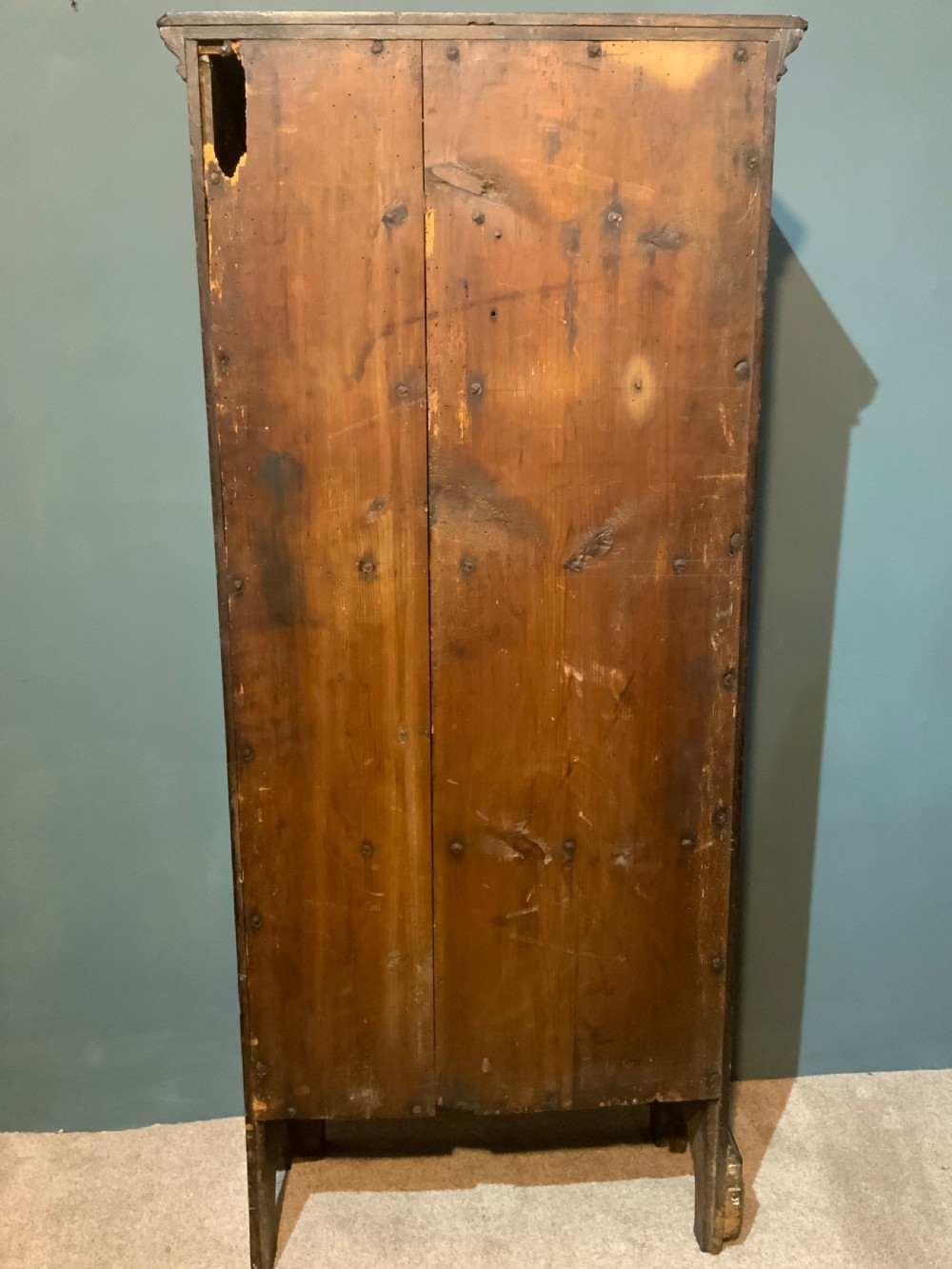 A tall slim, single door oak cabinet View VIII