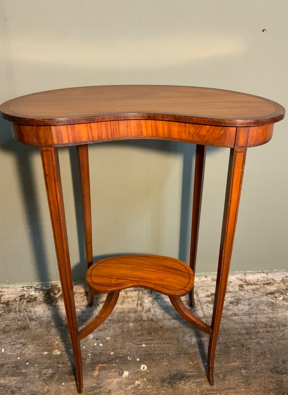 A Satinwood and tulipwood lamp table. View IV