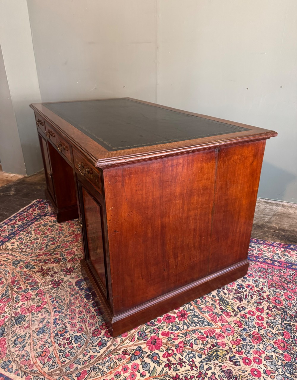 An Edwardian mahogany desk with painted swags and musical trophies View III