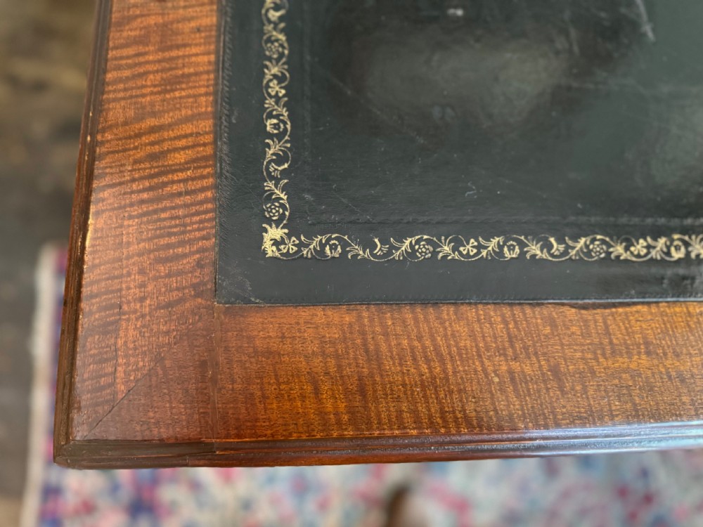 An Edwardian mahogany desk with painted swags and musical trophies View VII
