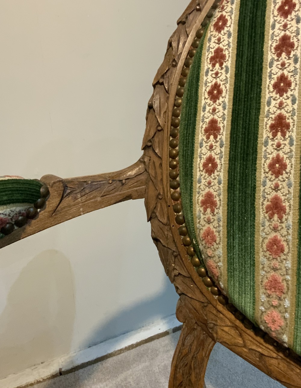 A pair of 19th-century French armchairs featuring carved wooden frames, oval backrests, and green and cream striped fabric upholstery. View VIII