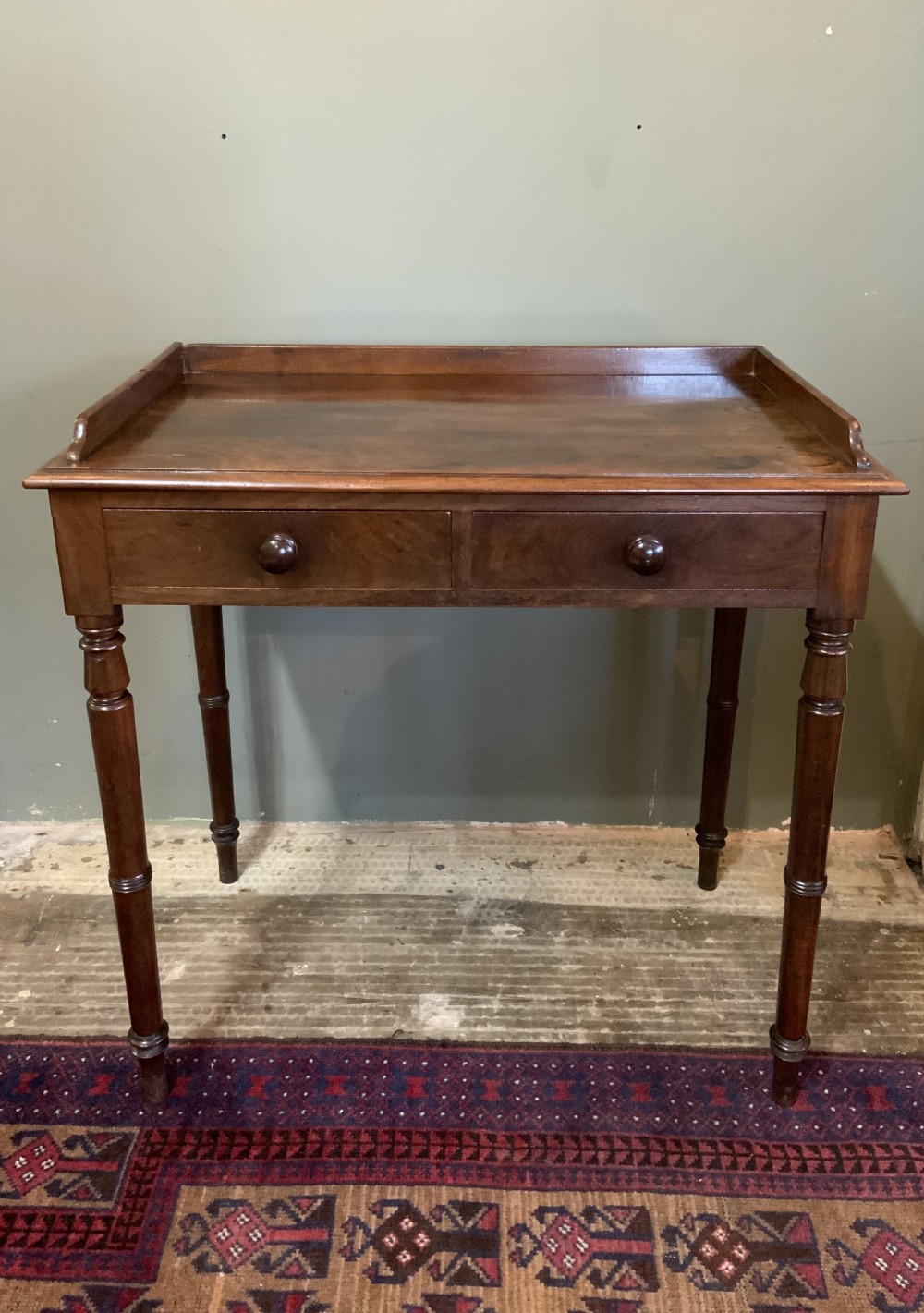A two drawer mahogany table