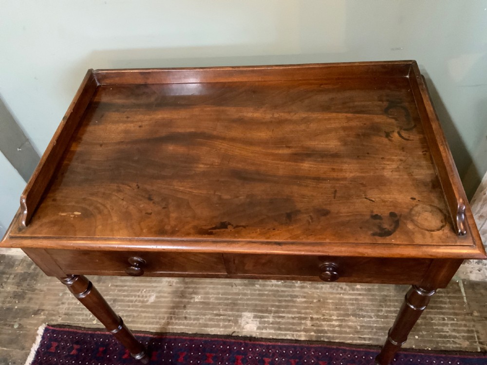 A two drawer mahogany table View III