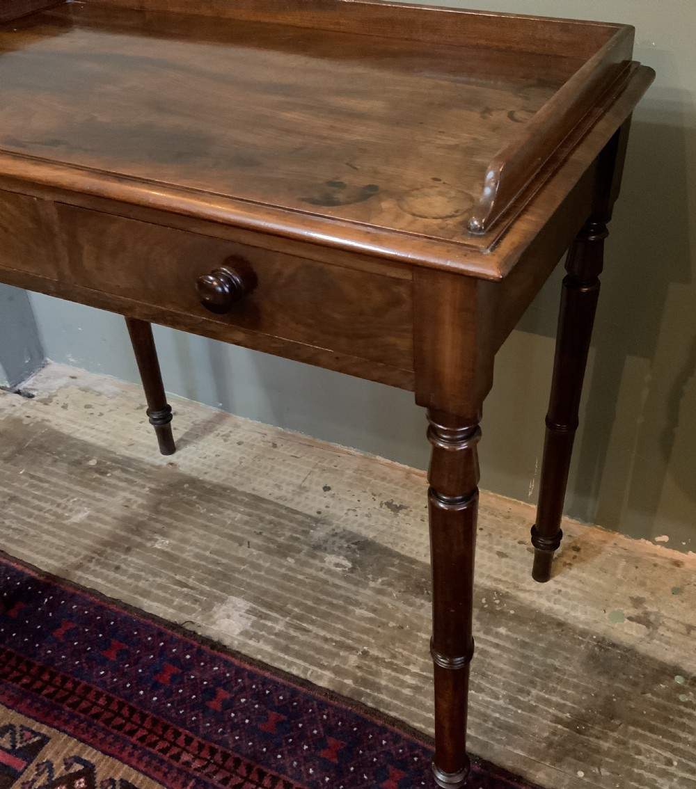 A two drawer mahogany table View IV