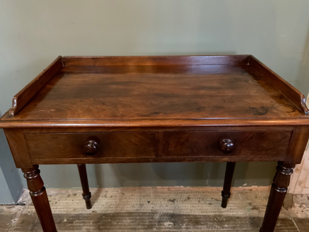A two drawer mahogany table View VI