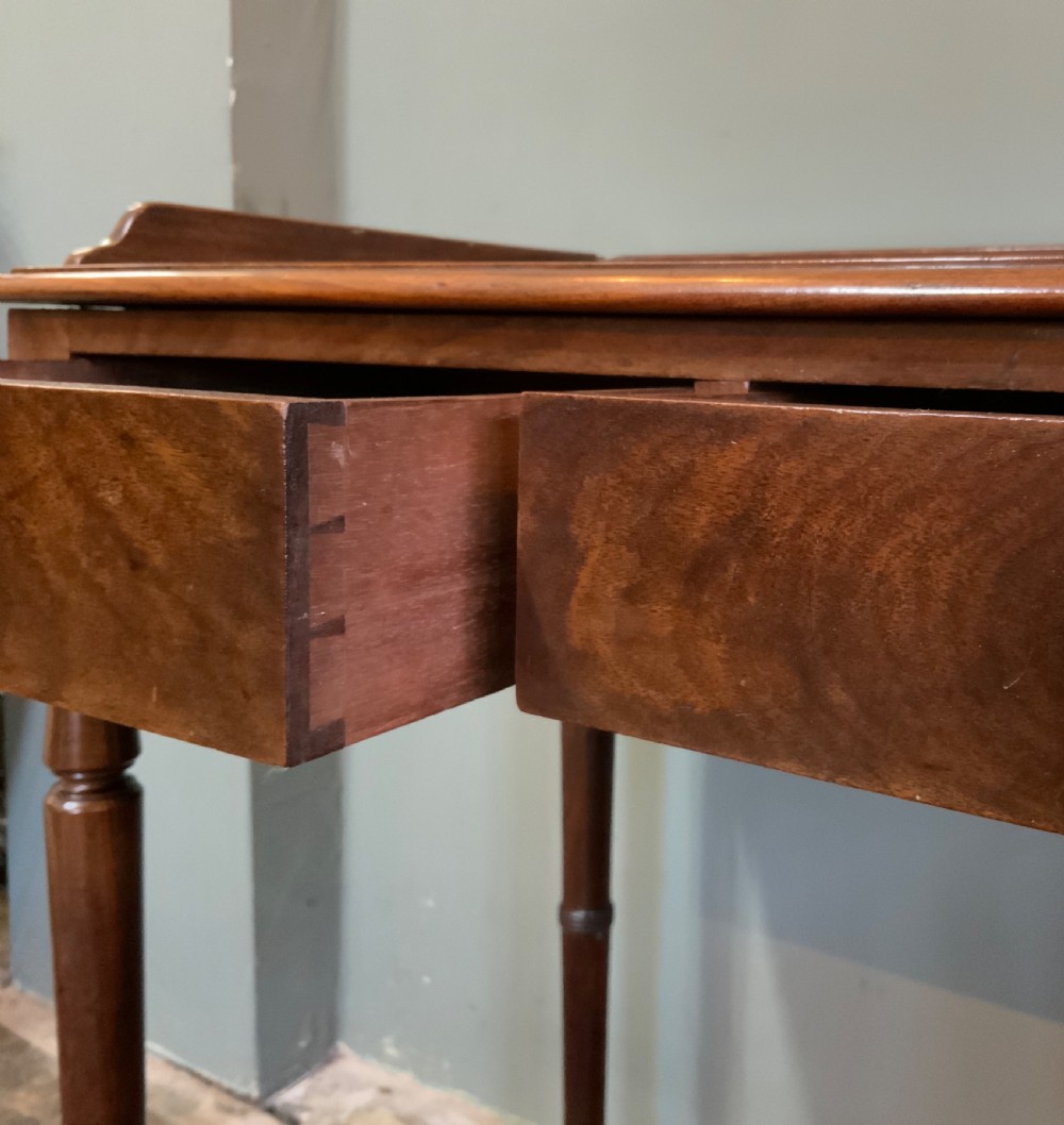 A two drawer mahogany table View VII