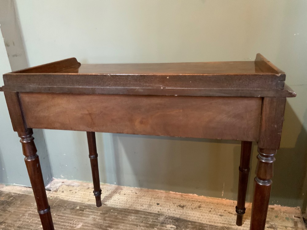 A two drawer mahogany table View IX