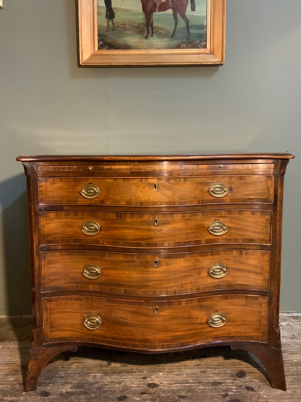 An 18th century mahogany serpentine chest