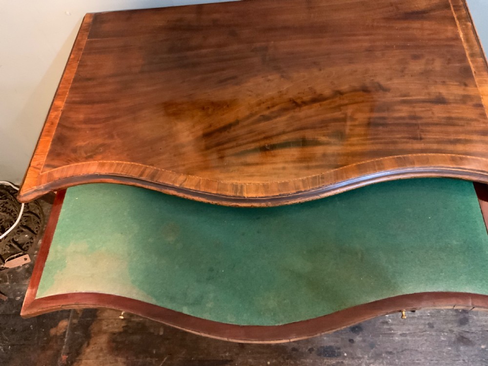 An 18th century mahogany serpentine chest View III