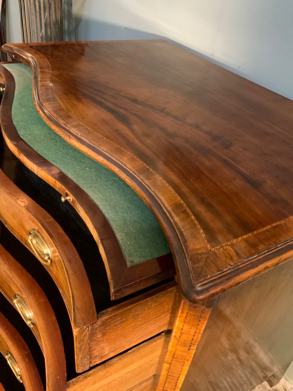 An 18th century mahogany serpentine chest View VIII