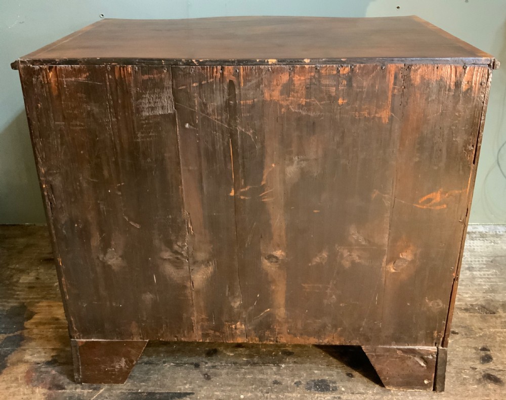 An 18th century mahogany serpentine chest View IX
