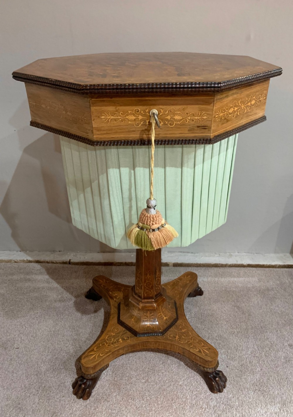 A Regency inlaid rosewood sewing table