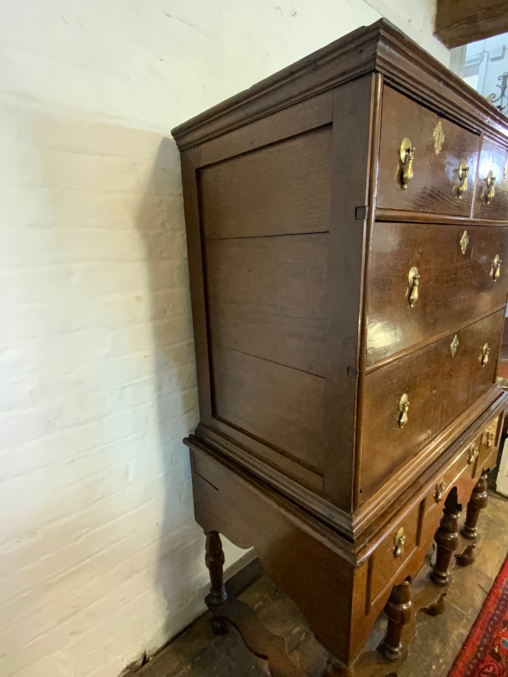 A Queen Anne period oak chest on stand View II