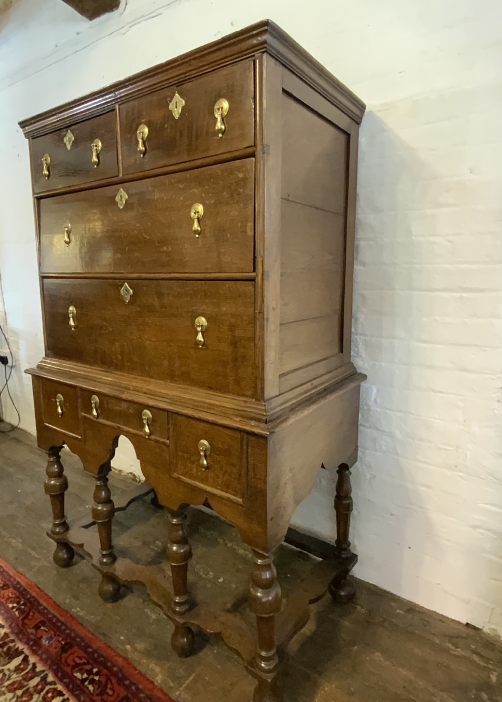 A Queen Anne period oak chest on stand View III