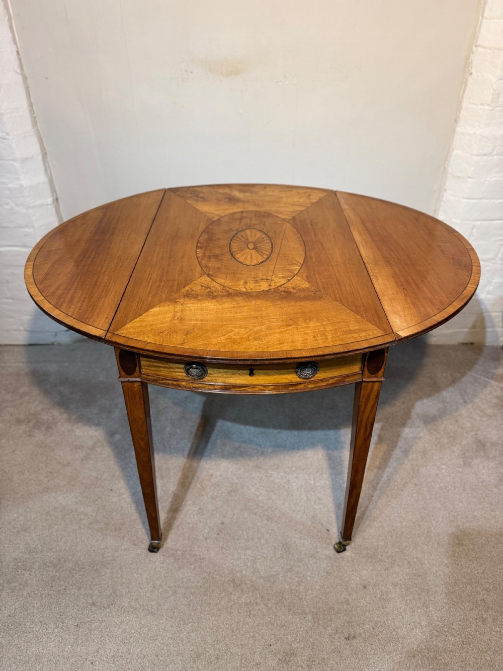 A GEORGE III SATINWOOD PEMBROKE TABLE