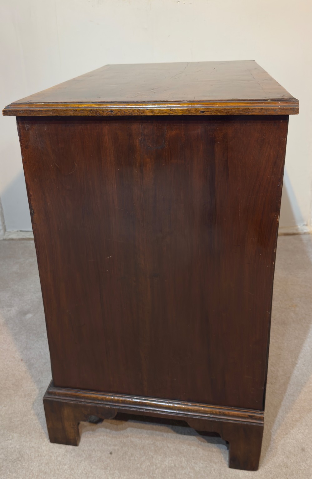 An 18th century walnut bachelors chest. View III