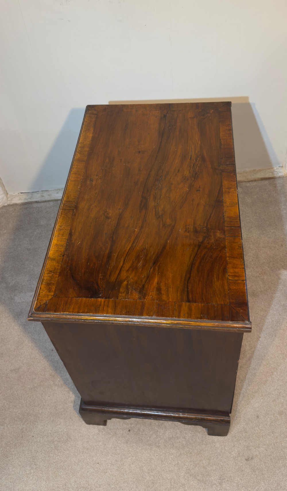 An 18th century walnut bachelors chest. View IV