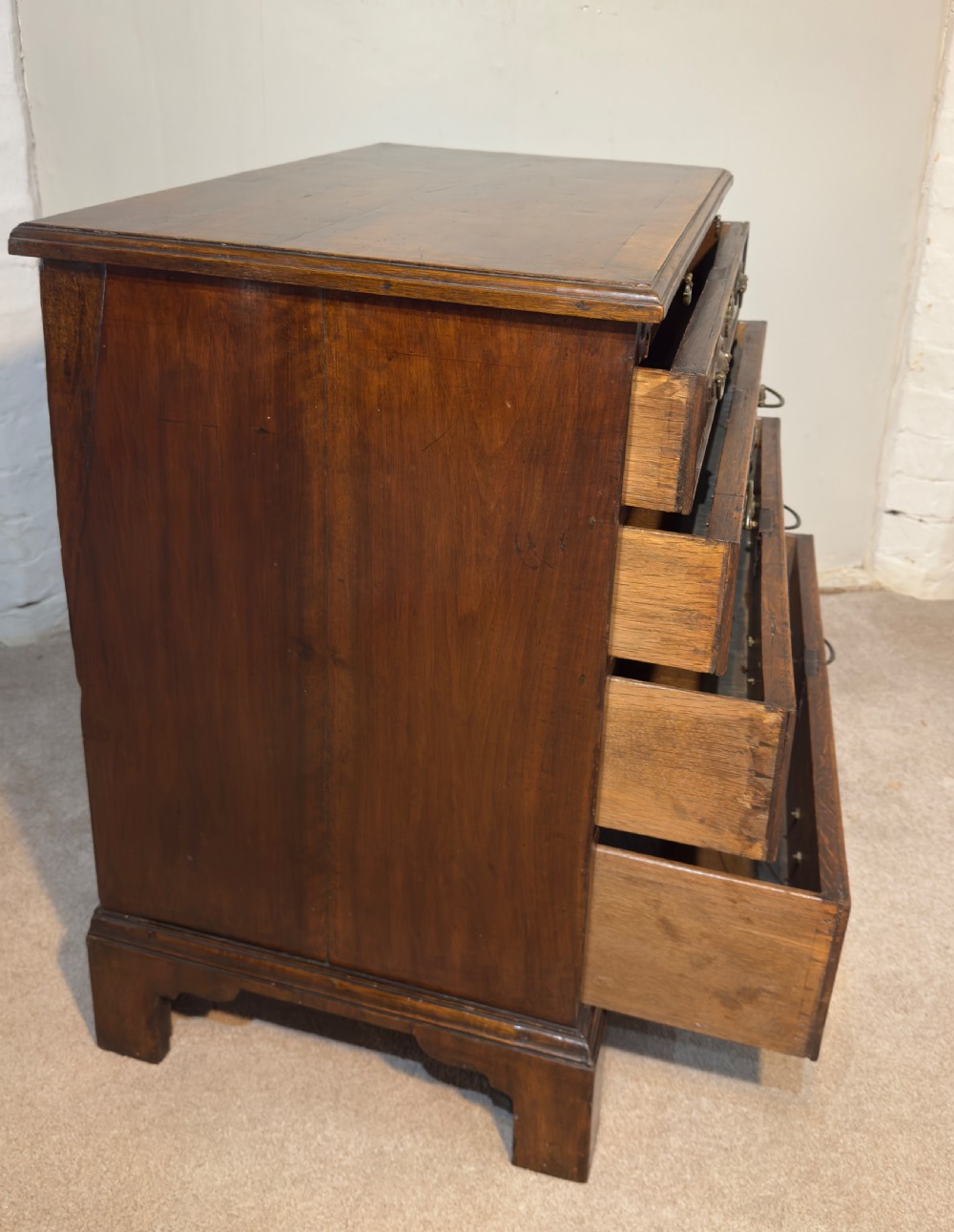 An 18th century walnut bachelors chest. View V