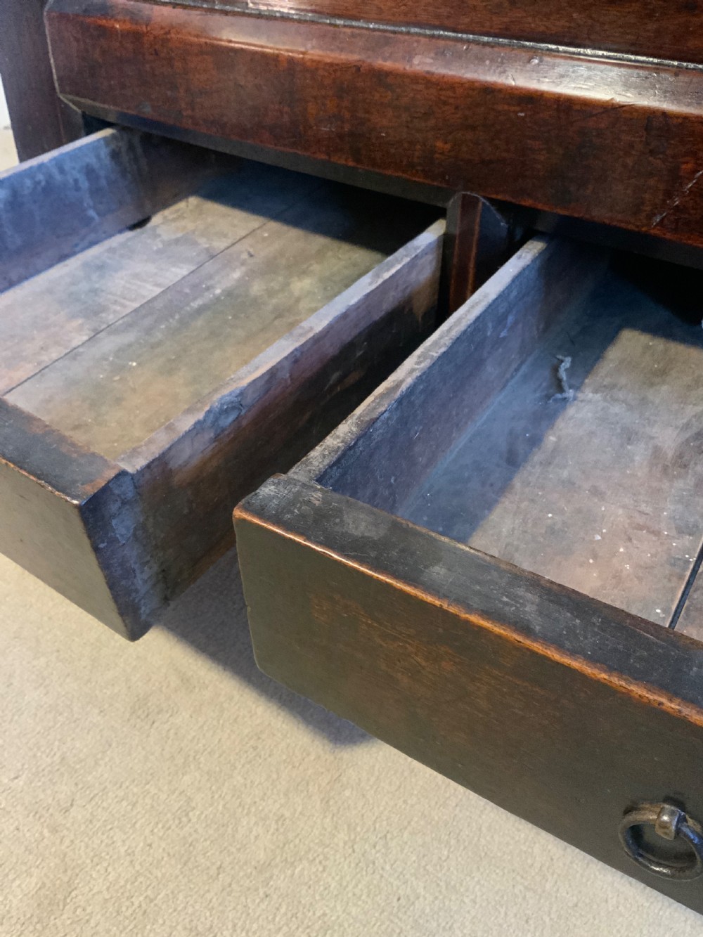 A dark brown 18th-century Chinese wooden chest featuring a top-opening lid, two lower drawers with metal ring handles, and iron latch hardware. View VIII
