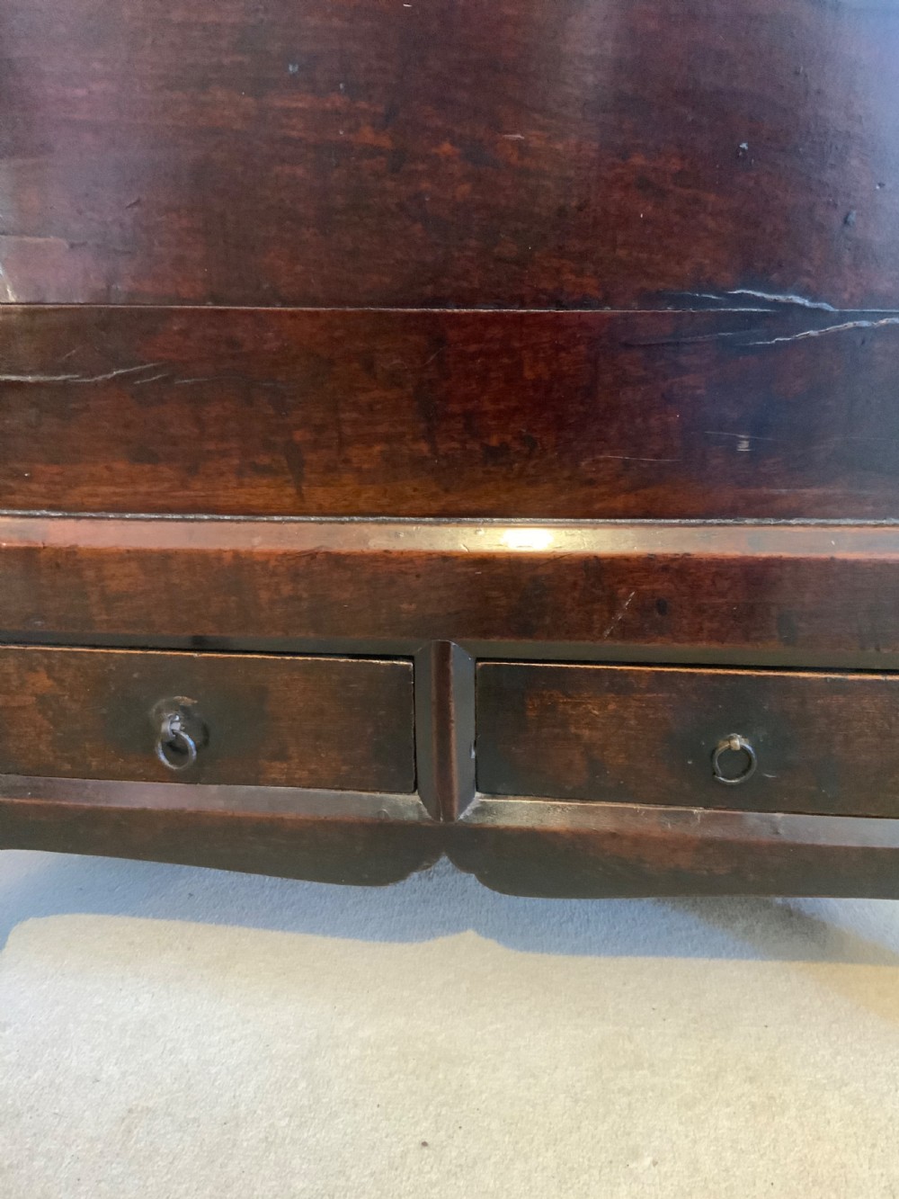 A dark brown 18th-century Chinese wooden chest featuring a top-opening lid, two lower drawers with metal ring handles, and iron latch hardware. View IX