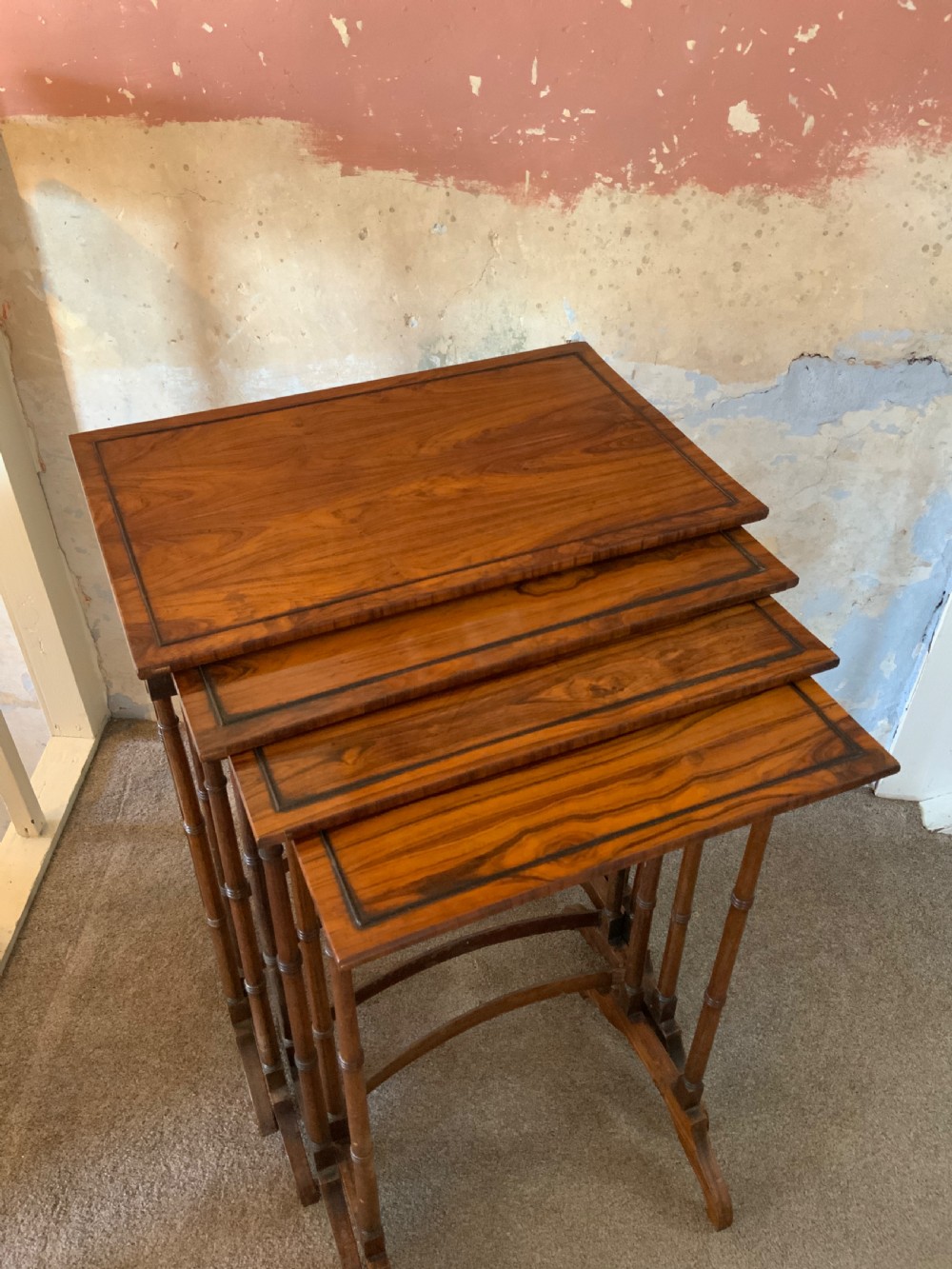 Nest of four Regency rosewood tables
