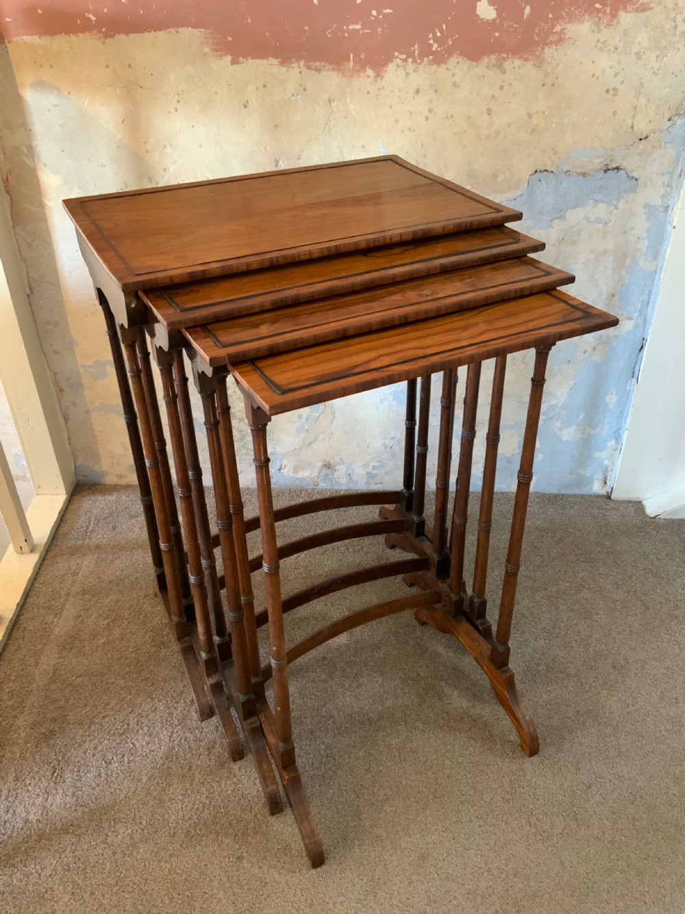 Nest of four Regency rosewood tables View II
