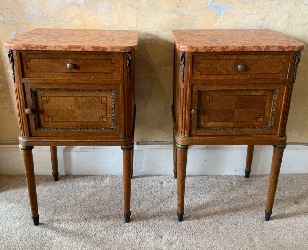 Pair of marble topped bedside cabinets