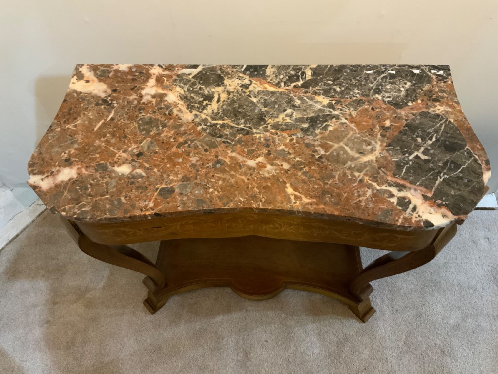 A mahogany console table featuring a shaped brown and grey marble top, floral marquetry frieze, curved cabriole legs, and a lower shelf. View III