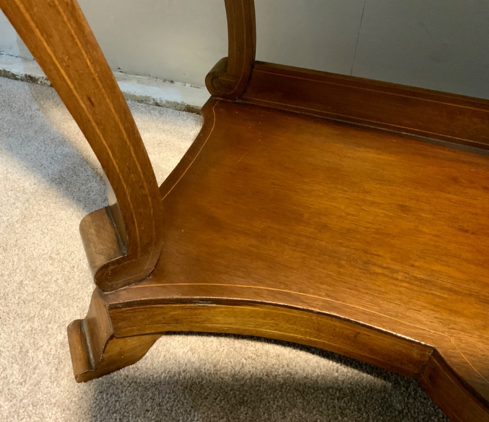 A mahogany console table featuring a shaped brown and grey marble top, floral marquetry frieze, curved cabriole legs, and a lower shelf. View VI
