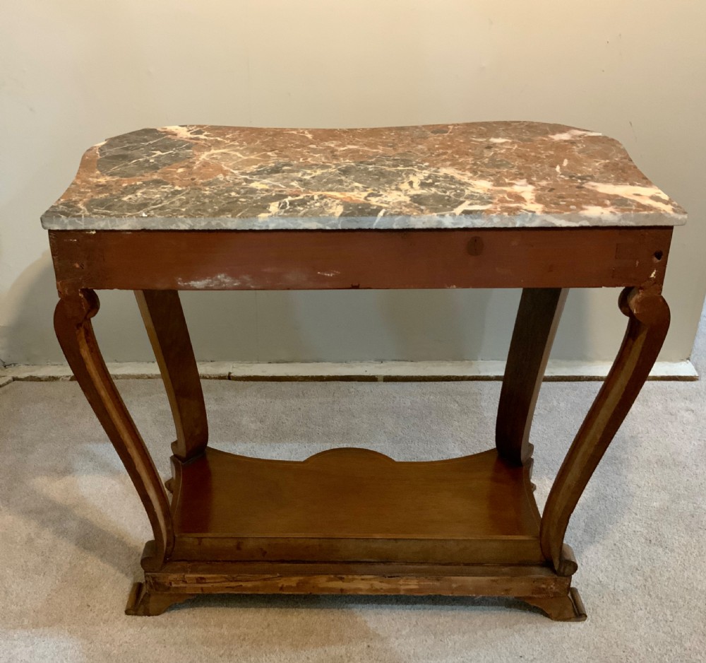A mahogany console table featuring a shaped brown and grey marble top, floral marquetry frieze, curved cabriole legs, and a lower shelf. View VII