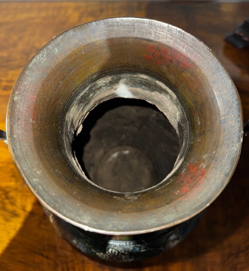 A dark patinated bronze vase with twin dragon handles and polychrome floral champleve enamelling around the body and neck. View VIII