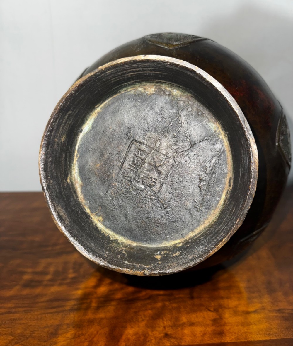 A dark patinated bronze vase with twin dragon handles and polychrome floral champleve enamelling around the body and neck. View IX