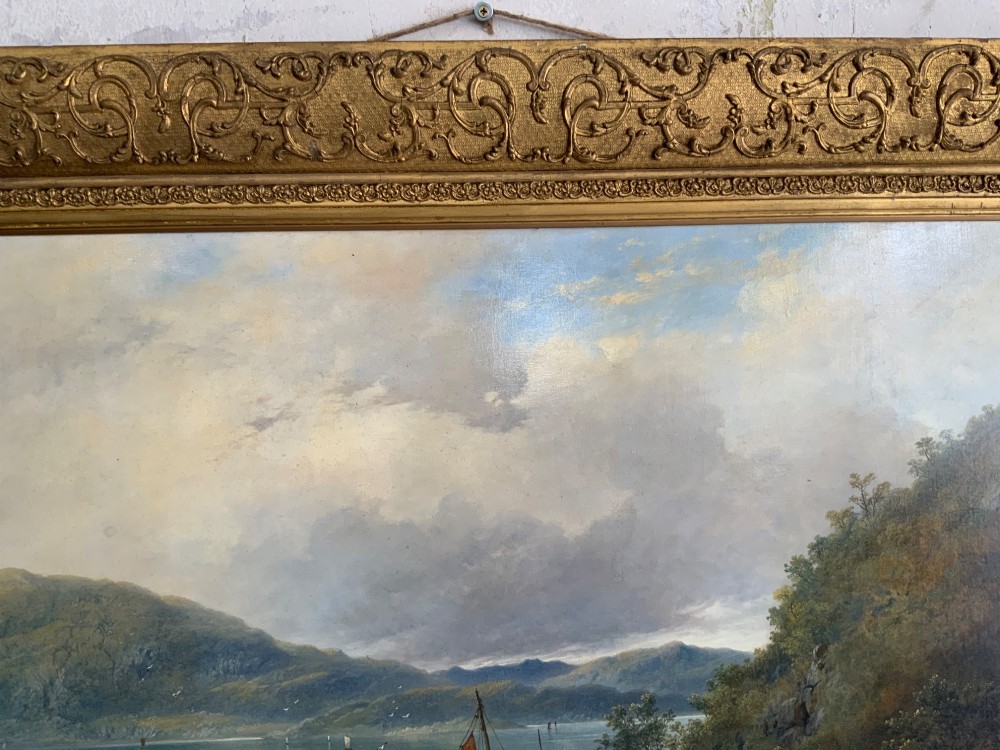 A 19th-century oil painting on canvas showing a coastal shoreline with sailing vessels, framed in an ornate gilded gesso frame. View VII