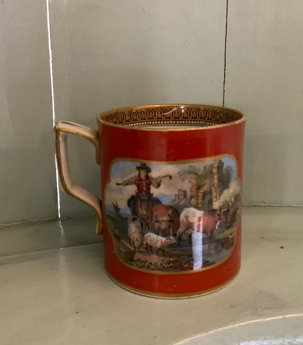 A twelve-piece collection of Victorian English Staffordshire Prattware ceramics including plates, mugs, and dishes with transfer-printed pictorial scenes and pink and gold borders. View VII