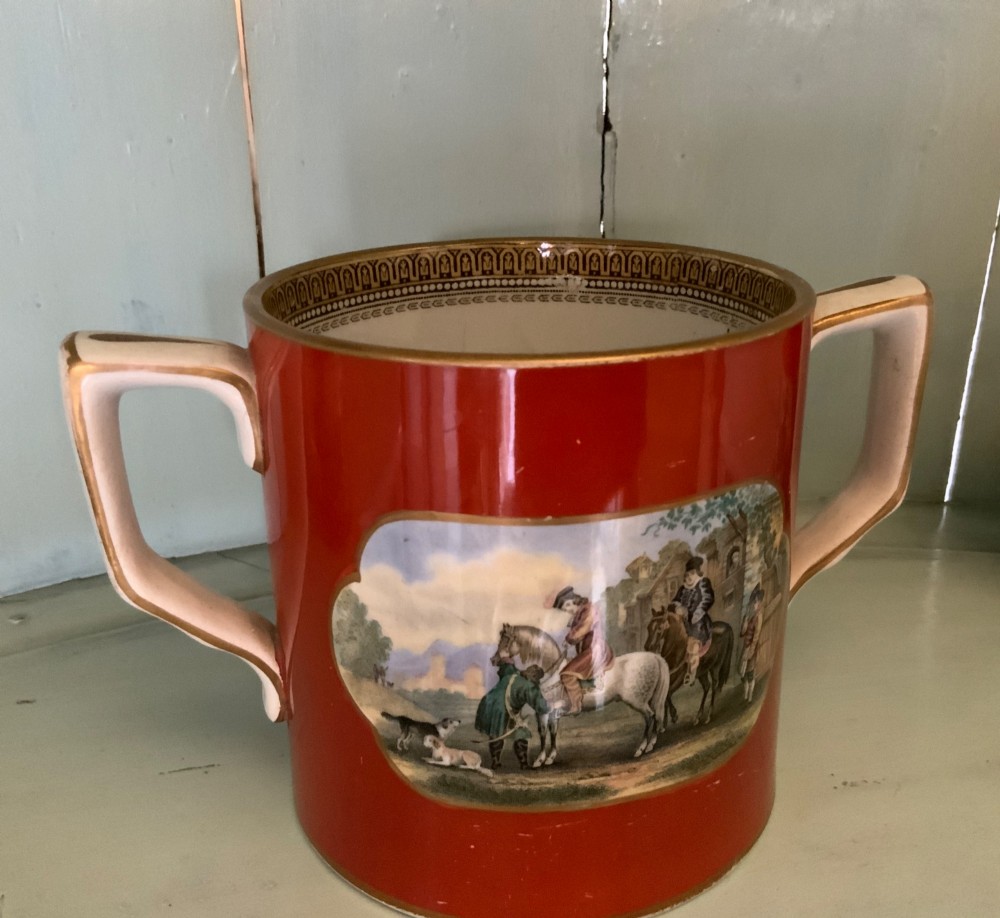 A twelve-piece collection of Victorian English Staffordshire Prattware ceramics including plates, mugs, and dishes with transfer-printed pictorial scenes and pink and gold borders. View VIII