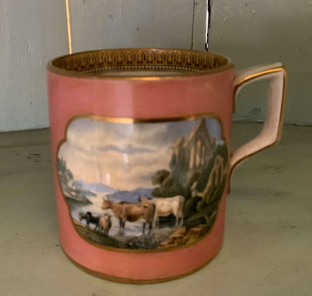 A twelve-piece collection of Victorian English Staffordshire Prattware ceramics including plates, mugs, and dishes with transfer-printed pictorial scenes and pink and gold borders. View X
