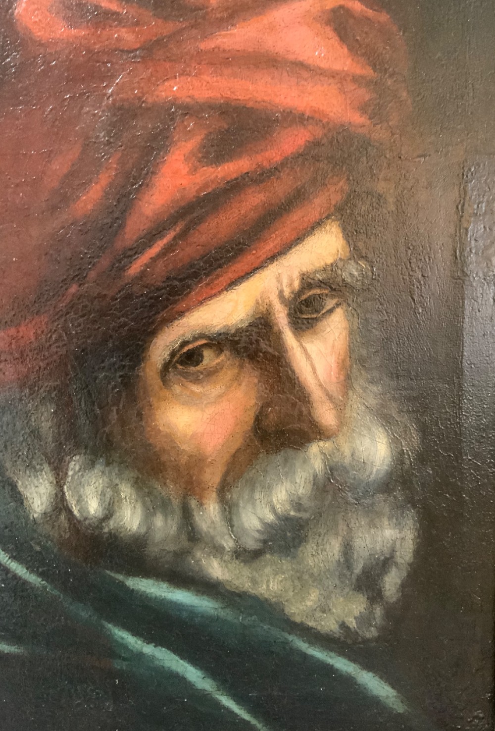 A 19th-century oil painting depicting a bearded gentleman in a red turban and dark robe, presented in an ornate rectangular giltwood frame. View II